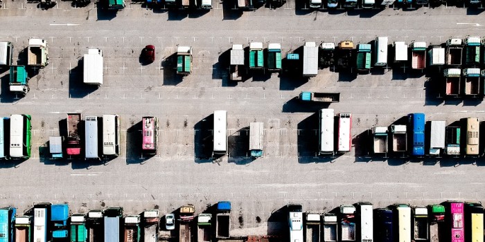 bird eye view of lorries parked up in a parking lot.